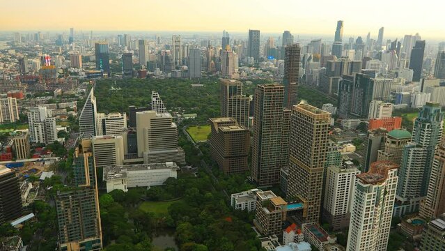 Aerial view of Ploenchit junction with cars traffic skyscraper buildings. Bangkok City in downtown at night, Thailand

