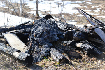 Garbage, metal, burnt logs after the fire.
