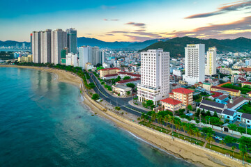 The coastal city of Nha Trang seen from above in the afternoon with its beautiful city and clean sandy beach attracts tourists to visit in Nha Trang, Vietnam