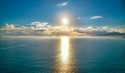 Aerial view of sunrise offshore as the sun rises to welcome a new day in the central coast of...