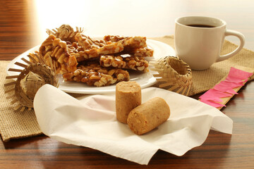 Paçoca candy. Brazilian desserts made of peanuts with coffee cup and straw hats