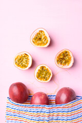 Passion fruit in bag on pink, Tropical fruit in summer season