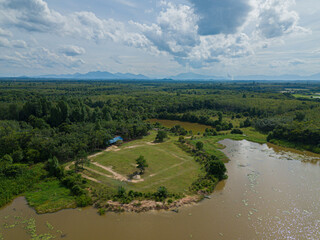 Fototapeta na wymiar Aerial drone view of a green rural scenery in Danau Tok Uban, Tanah Merah, Kelantan, Malaysia.