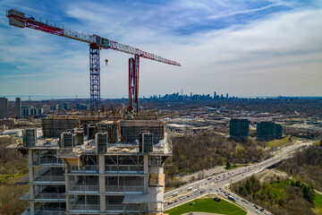 Aerial view near and around new constructions building development site. Modern architecture of skyscrapers and high rise housing. Real Estate concept. Empty working area, cranes and heavy machinery © desertsands