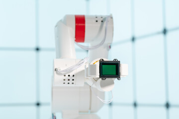 Robot arm with CCD and CMOS matrix Image sensor in the manipulator. Concept on the topic of artificial vision and pattern recognition