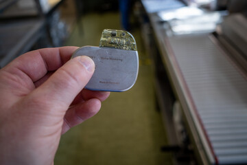 in a hand is an implantable defibrilator