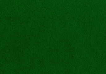 High resolution dpi scan of a fine grain fiber smooth paper texture background. Warm dark forest green colored wallpaper for natural product mockup material with copy space for text