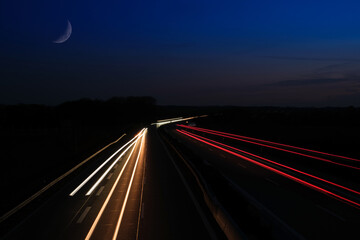 Obraz premium highway with light traces of cars in a long time exposure