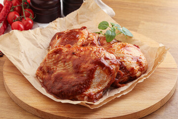 Marinated chicken leg in tomato sauce