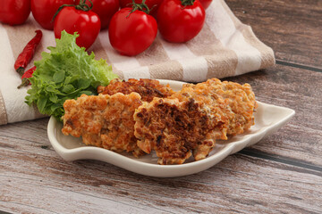 Fried salmonn cutlet in the bowl