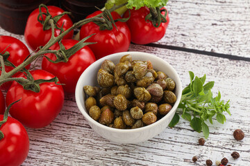 Marinated green capers in the bowl