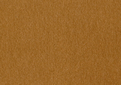 Highly detailed close up cardboard paper texture background fine grain caramel brown smooth uncoated corrugated fiberboard with copy space for text for material mockup or wallpaper