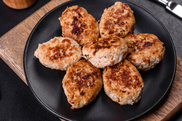 Delicious fresh fried minced meat patties on a dark concrete background