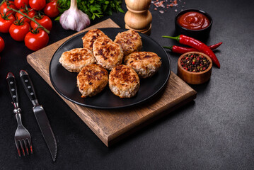 Delicious fresh fried minced meat patties on a dark concrete background
