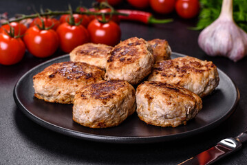 Delicious fresh fried minced meat patties on a dark concrete background