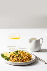 Vegetarian salad  Tabules with  bulgur grain and chopped parsley, tomatoes, mint, onion, bulgur and seasoned with olive oil and lemon juice on the restaurant table .Copy space