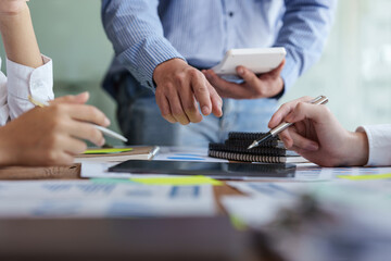 Fototapeta premium Group of IT consultant working by digital tablet and management big data and analyze financial document of company.