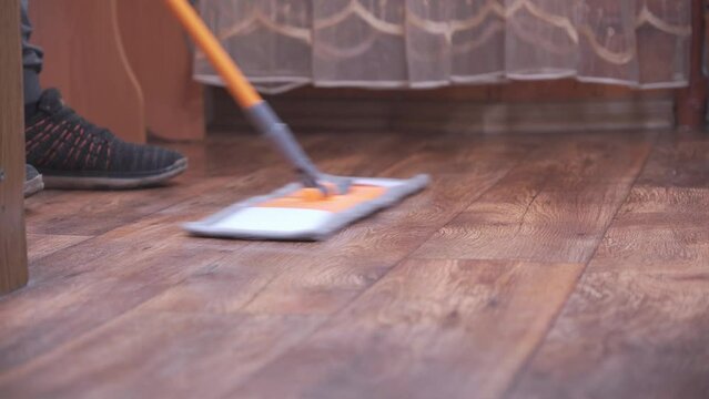 Wipe the floor with a mop.