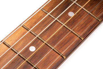 Selective focus, close up guitar neck and guitar strings on white background.