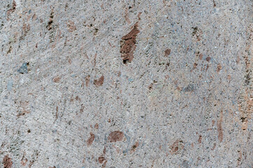 Stone texture. Detailed shot of sawn stone. Circular saw marks on the rough surface. Abstract...