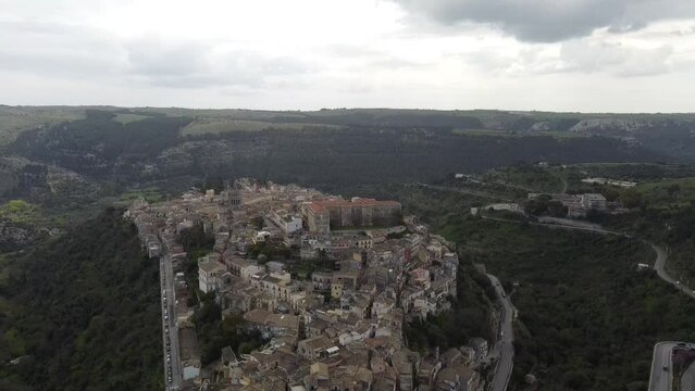 spectacular drone view over the old town of ragusa in sicily (italy), smooth movement
