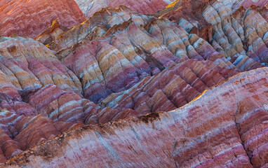 Sunrise over the colorful eroded badlands in the Zhangye Danxia National Geopark, Gansu Province, China
