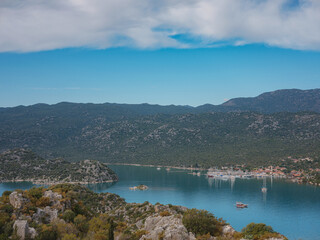 Fototapeta na wymiar Travel and tourist attractions at Kekova island, Turkey. beautiful view of seascape from Kalekoy Village, Demre, View with boat and islands in sea