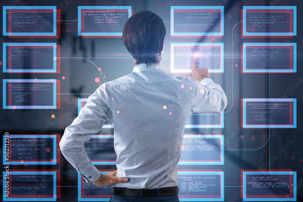 Poster Back view of businessman hand pointing at abstract creative coding programming hologram on blurry interior background. Science, technology and software concept. Double exposure.