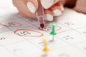 Calendar marks date with red marker. business meeting appointment date 22nd day of the month