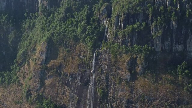 Drone shot of Mutarazi Falls in Zimbabwe - drone is descending, facing one of the waterfalls. Snippet could ideally be used for travel related videos or Zimbabwe or Africa movies.