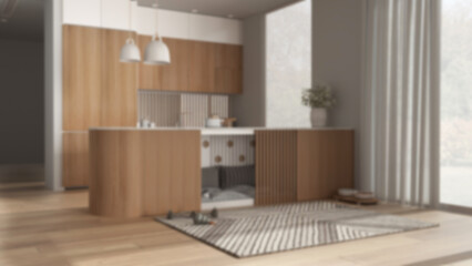Blur background, modern wooden kitchen, dog friendly space devoted to pets.Dog bed inside cabinets, pillows and toys. Windows with curtains, carpet, treat bowl. Interior design idea