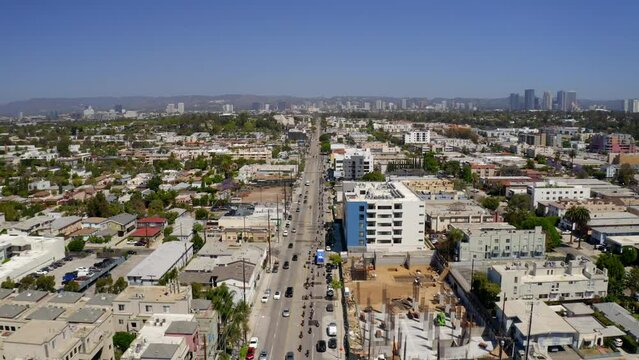 Aerial Shot Of Distinguished Gentleman'S Ride Event In City, Drone Flying Backwards On Sunny Day - Los Angeles, California
