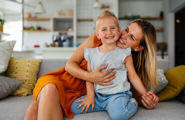 Love family parenthood childhood concept. Beautiful mother and her kid playing together at home