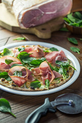 Pizza with Prosciutto on Served Table, Restaurant food