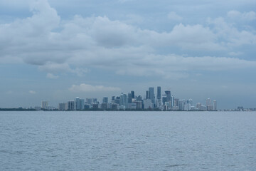 Fototapeta premium Miami as viewed from the water. Cloudy day casts a blue hue over the scene.