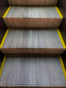 Ascending Metal Escalator Steps