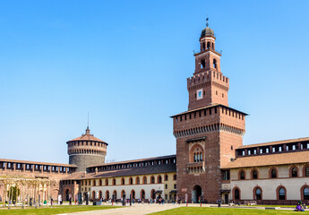 Obraz premium The Torre del Filarete in the Castello Sforzesco (Sforza Castle) in Milan, Italy, seen from the outer courtyard on a sunny day.
