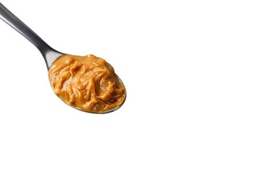 Peanut butter on spoon. Sweet Peanut butter sauce. Texture, Close up.