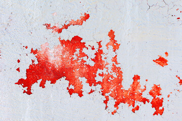 The texture of peeling gray with red paint wall