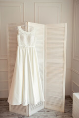 Wedding white dress prepairing. Fashionable bridal prepairing.