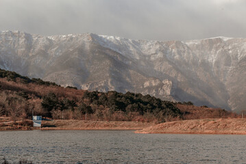 Lake with a view of the snow-capped peaks of the mountains