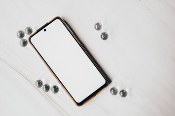 Elegant, simple and clean mockup of an android smart phone over marble background