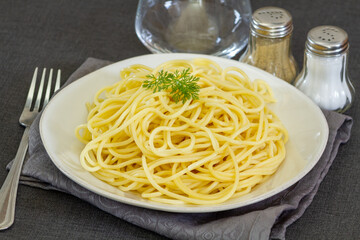 dish of plain cooked spaghetti on a table