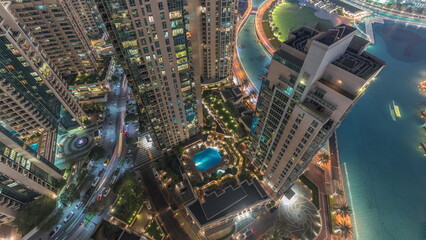 Skyscrapers skyline look down perspective in Dubai Downtown in the evening aerial timelapse.