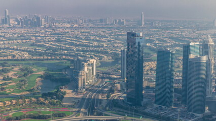 Naklejka na ściany i meble Big crossroad junction between JLT district and Dubai Marina intersected by Sheikh Zayed Road aerial timelapse.