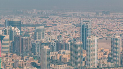 Dubai Aerial view showing al barsha heights and greens district area timelapse