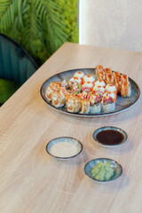 Colorful fresh rolls on a dish on the table in the restaurant