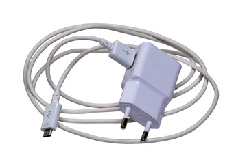 Closeup of a adapter charger with USB cable with Micro USB isolated on a white background. Macro...