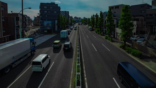 A timelapse of downtown street at Kanpachi avenue in Tokyo wide shot panning