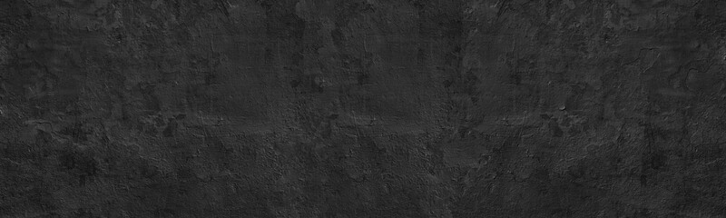 Black old exterior concrete wall with cracked detached paint wide panoramic texture. Dark gloomy...